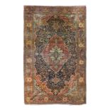 A LARGE SAROUK FEREGHAN CARPET, WEST PERSIA, red ground within floral borders. 17' 8.5" x 11'