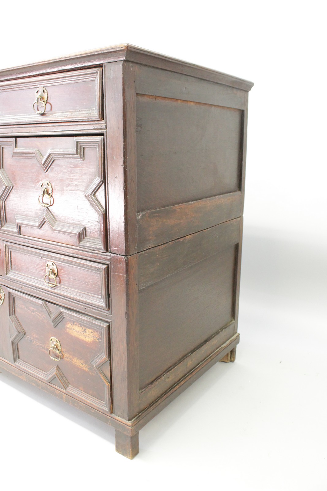 A 17TH CENTURY OAK CHEST OF DRAWERS, in two parts, with four long drawers, brass drop handles on - Image 3 of 3