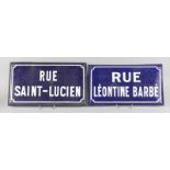 TWO FRENCH BLUE AND WHITE SIGNS, RUE SAINT-LUCHEN and RUE LEONTINE BARBE. 17ins x 10ins.