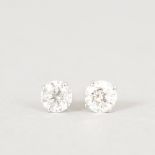 A PAIR OF .50CT SINGLE STONE DIAMOND STUD EARRINGS.