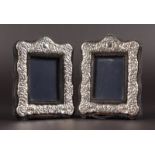 A SMALL PAIR OF FLORAL PHOTOGRAPH FRAMES. 3ins x 2.5ins.