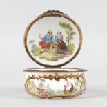 A 19TH CENTURY FRENCH PORCELAIN CIRCULAR BOX AND COVER, the lid painted with two men, the side two