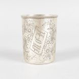 A SMALL RUSSIAN BEAKER, engraved with flowers. Initials M.C.H. 6.5cms high, stamped 84 A.P. 1888