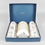 A ROYAL WORCESTER BOTANICAL PORCELAIN SET, six coffee cans and saucers, in original box.