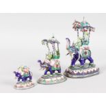 A GARNITURE OF THREE INDIAN SILVER AND ENAMEL CEREMONIAL ELEPHANTS, of diminishing sizes, 4.75ins,