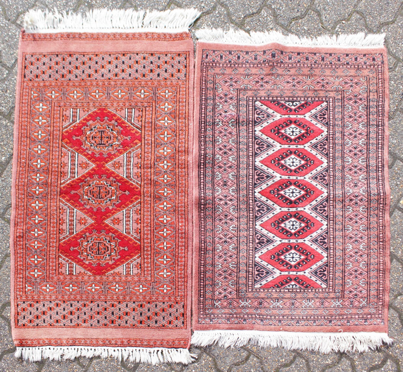 A PERSIAN DOUBLE BORDER RUG, salmon ground, 3ft 2ins x 2ft; together with a similar example. 2ft