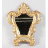 A SMALL 18TH CENTURY ITALIAN CARVED AND GILDED WOOD MIRROR. 14.5ins high.