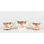 A ROYAL CROWN DERBY TYG, LOVING CUP AND MUG (3).