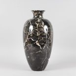 A LARGE BLACK AND GOLD MARBLE VASE. 17ins high.