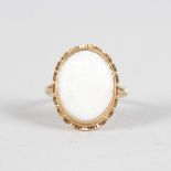 A LARGE OVAL OPAL 9CT YELLOW GOLD RING.