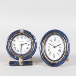 TWO CARTIER TRAVELLING CLOCKS with quartz movement, No. 7522 04832 and 7519 02043.