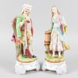 A RARE PAIR OF 19TH CENTURY BISQUE FIGURES OF A TURKISH MAN AND WOMAN, the man carrying a gun, the