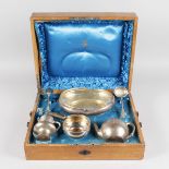 A RUSSIAN SILVER TEA SET, OVAL BASKET, sifter spoon, sugar tongs and fork by KHLEBNIKOV, in original