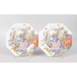 A PAIR OF OCTAGONAL PLATES painted with flowers and insects.