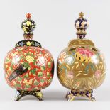 A RARE PAIR OF ZOLAN BALL SHAPED VASES with multi-coloured decoration, with flowers, palm trees etc.