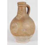 A GOOD BELLARMINE STONEWARE JUG. 9ins high.