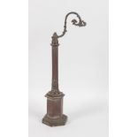 AFTER THE ANTIQUE A STANDING BRONZE LAMP, fluted column on an hexagonal base. 14ins high.