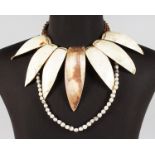 A FIJIAN SHELL NECKLACE and A WHITE SEED NECKLACE.