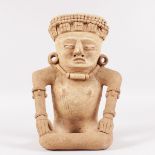 A VERACRUZ MEXICAN TERRACOTTA OF A SEATED FIGURE, 7TH-8TH CENTURY, REMOJADAS CULTURE. 14ins high.