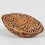 A GOOD CARVED SNUFF BOX carved with a basket of flowers. 7cms long.