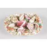 A COALPORT DISH encrusted with shells and flowers. 5ins long.