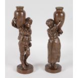 A PAIR OF 19TH CENTURY FRENCH BRONZE FIGURES OF A BOY AND GIRL carrying pitchers and standing on