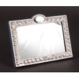 A RECTANGULAR PHOTOGRAPH FRAME with scroll decoration. 5.5ins x 7ins.