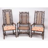 THREE LATE 17TH CENTURY WALNUT ARMCHAIRS, all with carved cresting rails, cane work back panels,