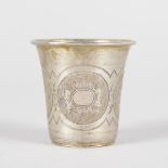 A SMALL ENGRAVED RUSSIAN BEAKER with four engraved panels of flowers. 4cms high. Marks Rubbed. 84.