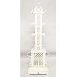 A VICTORIAN WHITE PAINTED CAST IRON COAT AND STICK STAND with pierced back, seven coat hooks and two