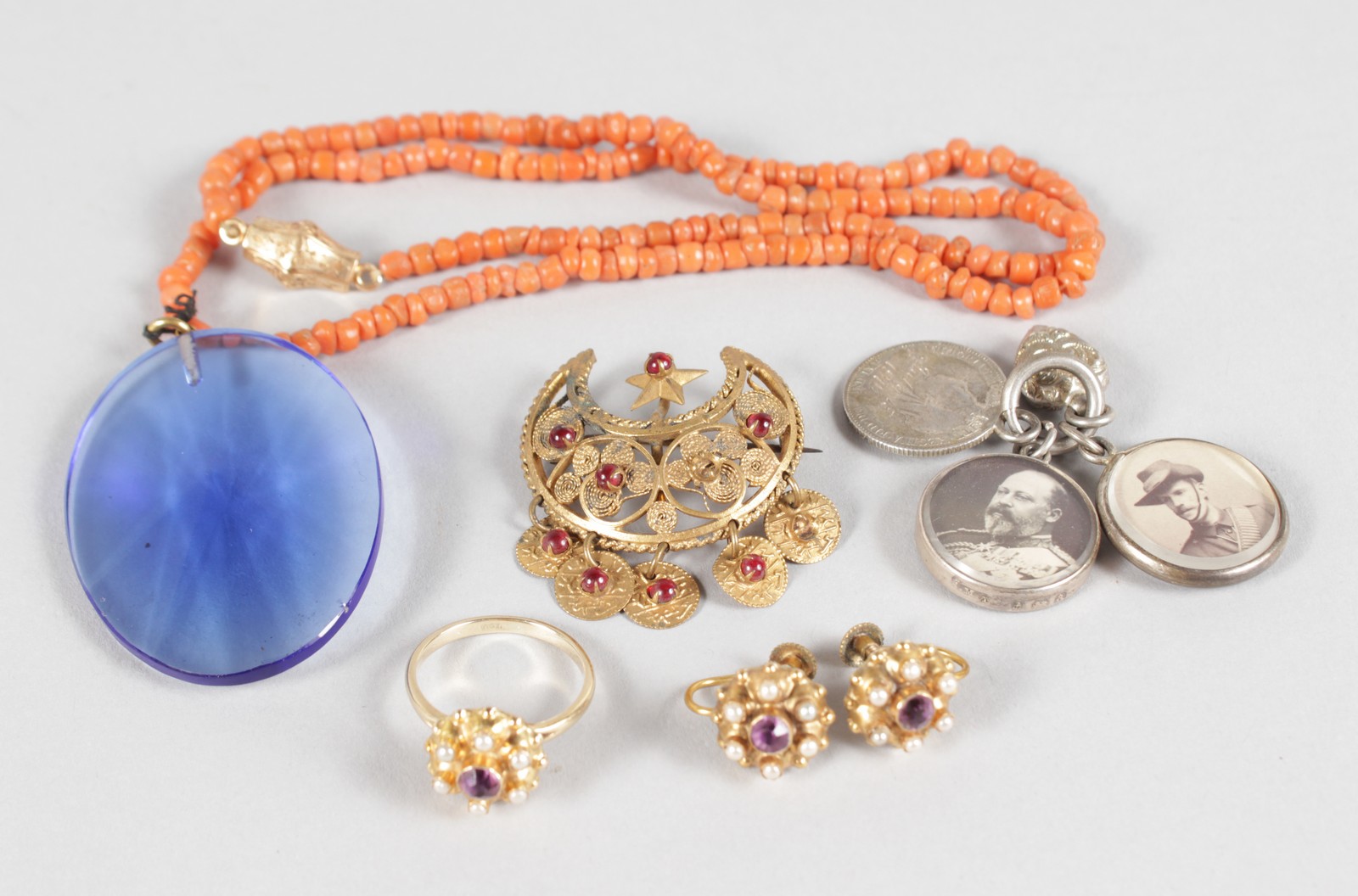 A FILIGREE BROOCH, three fobs, coral necklace, gold ring and pair of earrings.