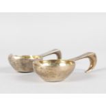 A SMALL PAIR OF PLAIN RUSSIAN QUAICH with looped handles, 9cms long, stamped 84 A. & C. 1892 K.A.