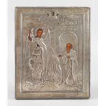 A RUSSIAN ICON, MOSCOW 1908, St Michael and a Saint, with silver overlay. 18cms x 15cms.