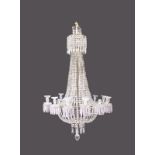 A SUPERB LARGE CUT CRYSTAL CHANDELIER, with rows of prisms and fourteen candle sconces with prism