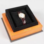 A BAUME & MERCIER WRISTWATCH, in original box.