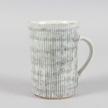 ROBERT SPERO A GREY POTTERY MUG. Monogrammed.