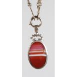 A VICTORIAN SILVER AND AGATE PENDANT on a LONG SILVER CHAIN.