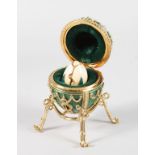 A GOOD FABERGE ENAMEL EGG AND STAND in Faberge blue velvet box.