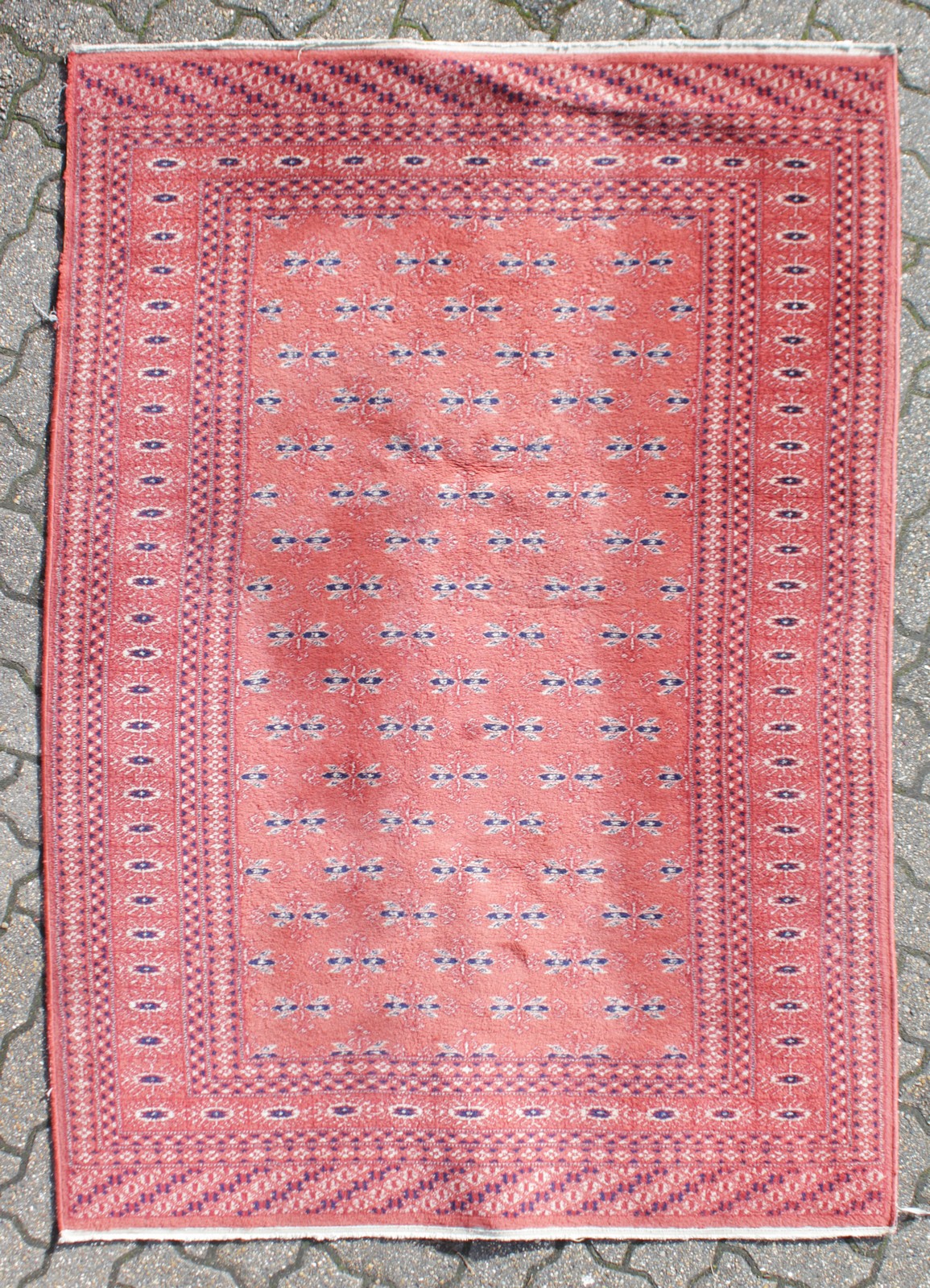 A PERSIAN WOOL CARPET, red ground, double border with central repeat pattern. 6ft x 4ft 3ins.