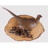 A CARVED WOOD WALL PLAQUE OF A PHEASANT. Monogrammed S.C. 26ins long overall.