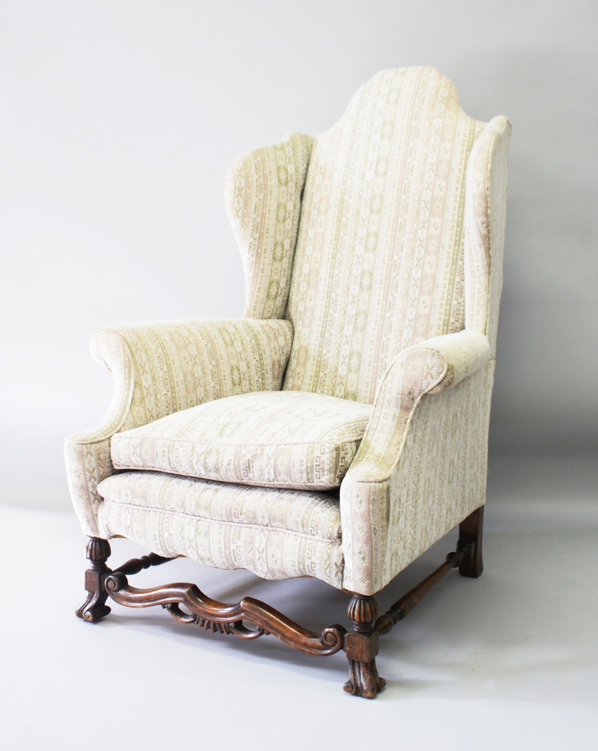 A QUEEN ANNE STYLE UPHOLSTERED WING ARMCHAIR, 20TH CENTURY, with high back, outward curving arms, on