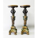 A SUPERB PAIR OF CARVED PAINTED AND GILDED BLACKAMOOR STANDS, the tops inset with a malachite panel,