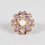 AN AMETHYST AND PEARL 9CT YELLOW GOLD DRESS RING.