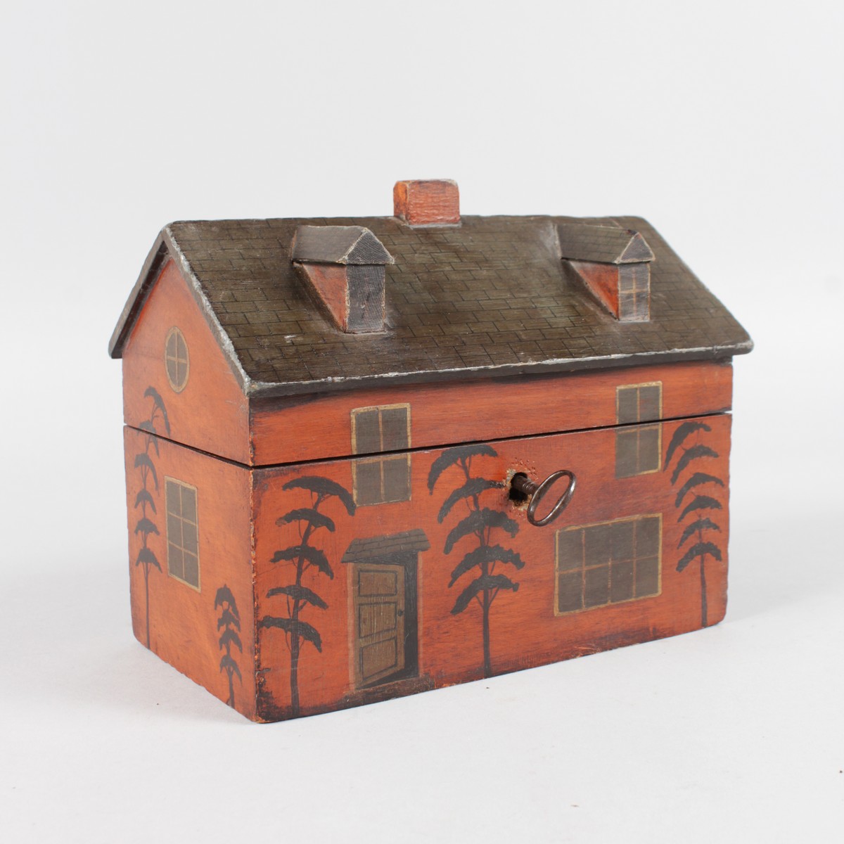 A GEORGIAN PAINTED WOOD TEA CADDY, the roof with chimney, two dormer windows, lift up roof, two