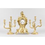 A LOUIS XVI ORMOLU THREE PIECE CLOCK GARNITURE, the clock with acanthus scrolls and motifs, with