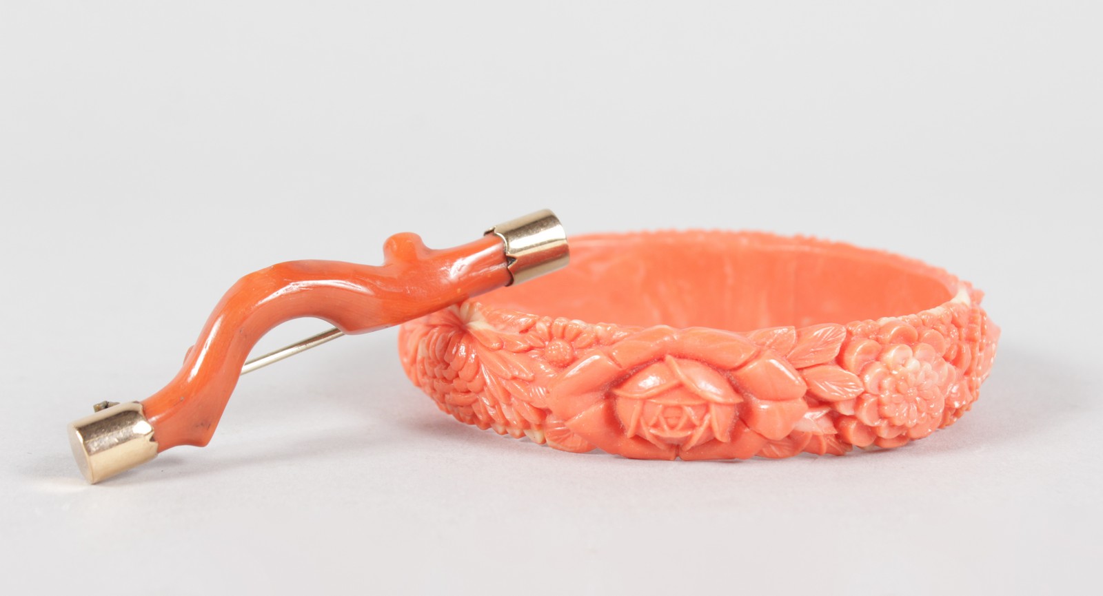 A RED CORAL BROOCH AND BRACELET.