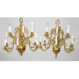 A PAIR OF DUTCH BRASS DOUBLE ROW CHANDELIERS with six scrolling branches in each row. 2ft long,