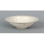 A CHINESE DING WARE SHALLOW PORCELAIN DISH, Song Dynasty or later, the interior centre moulded