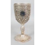 A GOOD LARGE INDO-PERSIAN SILVER-METAL GOBLET, weighing 785gm, pierced and embossed with animals and