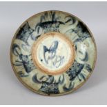 A 17TH/18TH CENTURY CHINESE PROVINCIAL DISH, painted with stylised calligraphy and bamboo, 11in(